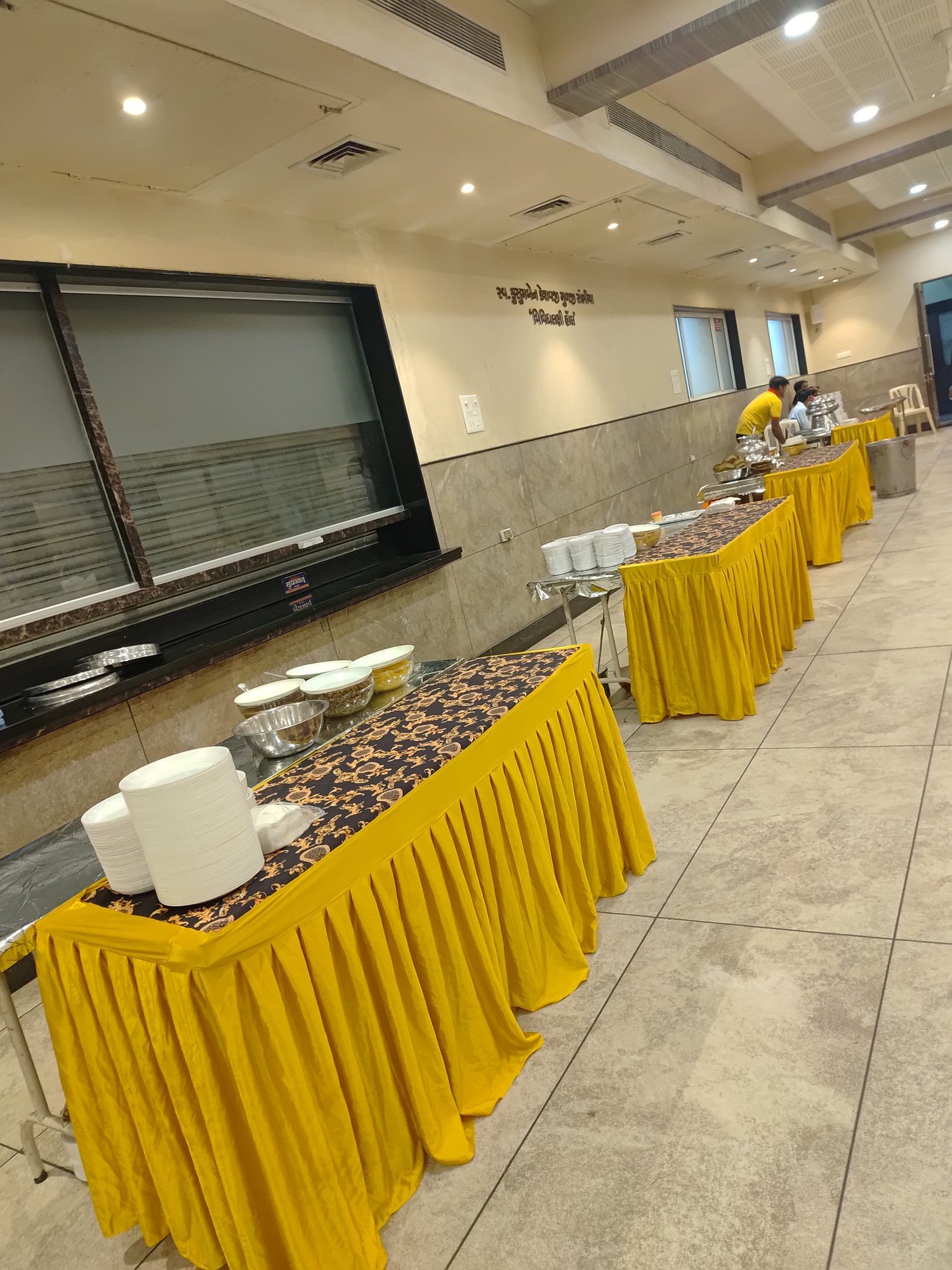Buffet counters lined up in a hall, ready for service