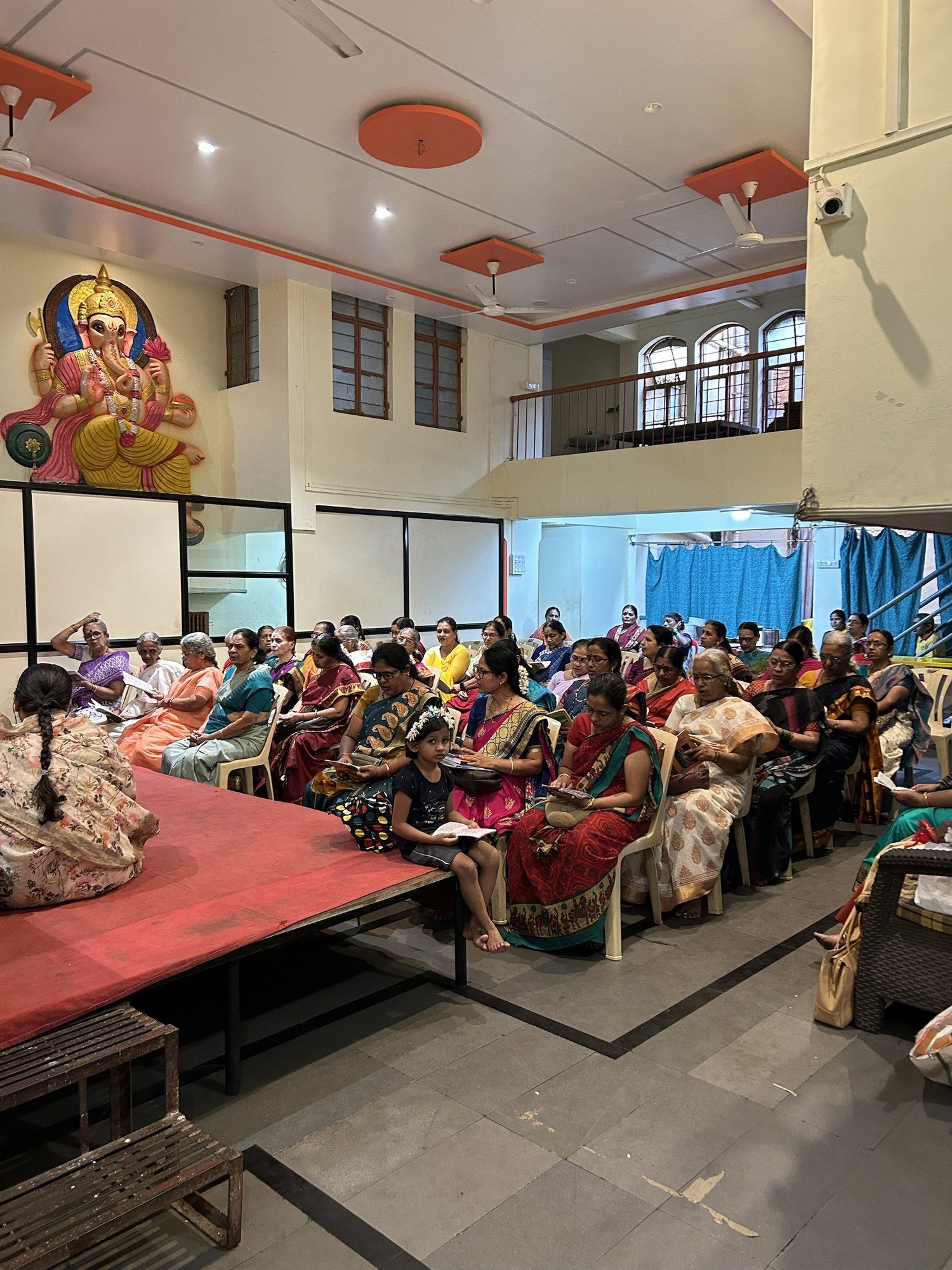 Guests gathered in a hall for a function